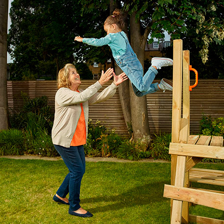 grandmother and grandchild playing in garden