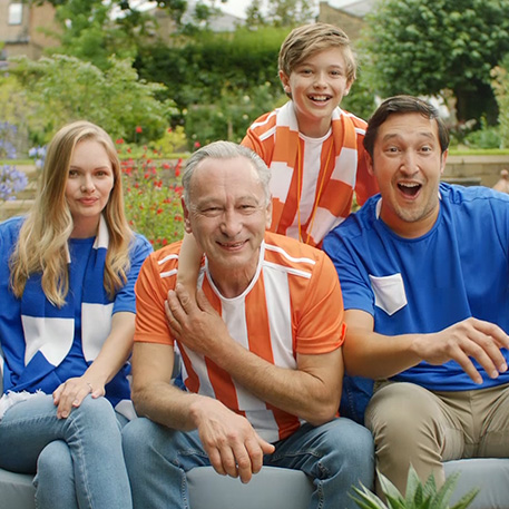 Family watching a football match