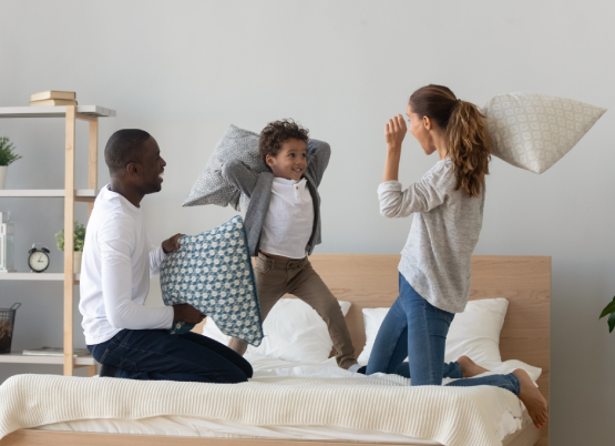 Family fighting with pillows
