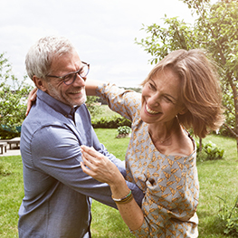 A man and women dancing in the garden 