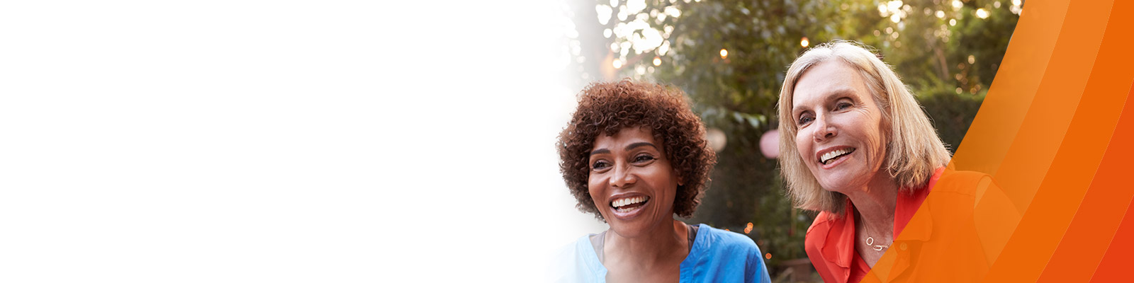 three women smiling outside