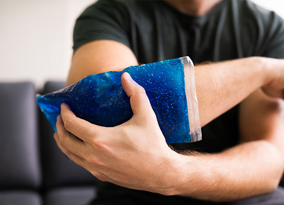 Icing your joints to help with Osteoarthritis pain Man icing his elblow